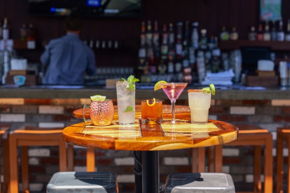 A row of cocktails lined up along the MudHen bar